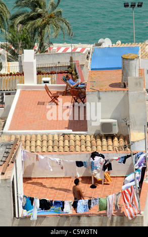 Rooftop dwellings on the coast in Ibiza a Spanish island resort. Stock Photo