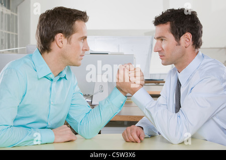 Germany, Munich, two Business men arm wrestling Stock Photo