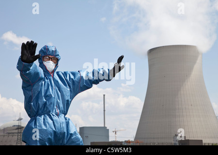 Germany, Bavaria, Unterahrain, Man with protective workwear standing at AKW Isar Stock Photo