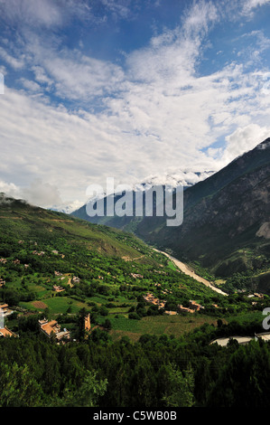 Houses scattered on the hillside at Jiaju Tibetan Village. Sichuan, China. Stock Photo