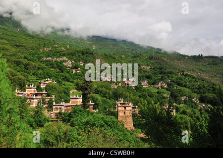 Traditional style houses scattered on the hillside at Jiaju Tibetan Village. Sichuan, China. Stock Photo