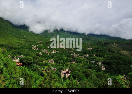 Traditional style houses scattered on the hillside at Jiaju Tibetan village. Sichuan, China. Stock Photo