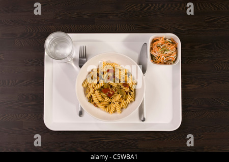 Noodle dish and salad on tray, elevated view Stock Photo