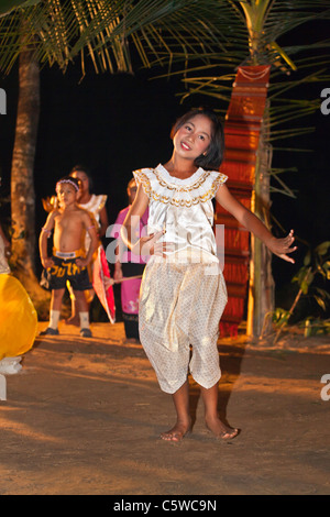 A Thai girl does a traditional dance during the LOI KRATHONG FESTIVAL at the HOME AND LIFE ORPHANAGE - THAILAND Stock Photo