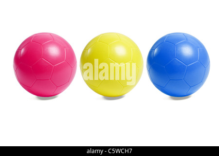 Colorful plastic toy soccer balls on white background Stock Photo