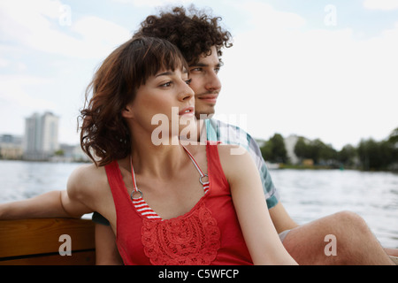 Germany, Berlin, Young couple on motorboat, portrait Stock Photo