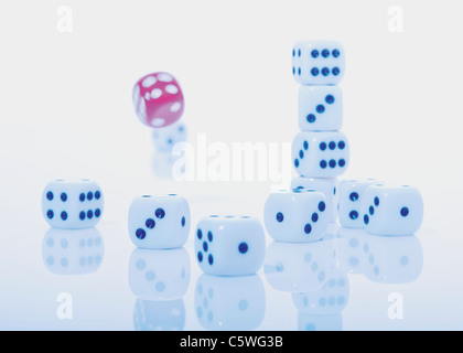 Many dice with red red dice falling in background Stock Photo