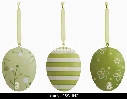 Three green easter eggs against white background, close up Stock Photo