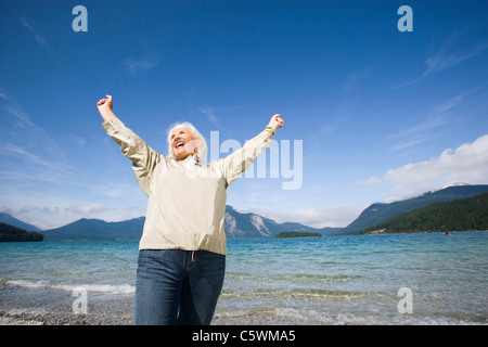 Germany, Bavaria, Walchensee,  Senior woman, cheering Stock Photo
