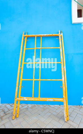 Colorful Mediterranean facade being renovated, traditional architecture ...