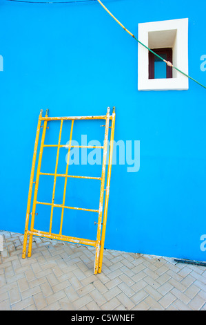 Colorful Mediterranean facade being renovated, traditional architecture ...