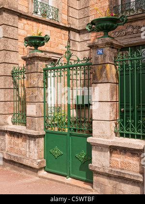 Green Gates to a French house Stock Photo