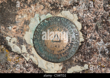 US Coast and Geodetic Survey Triangulation Station Mountaintop Benchmark, Hurricane Mountain in the Adirondacks, Placed in 1942 Stock Photo