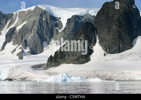 Glacier, iceberg, mountain and rocks in Antarctica Stock Photo