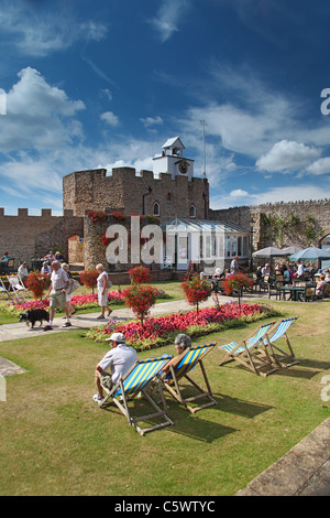 Holidaymakers enjoying the sunshine inside the walls of Connaught Gardens in Sidmouth, Devon, England, UK Stock Photo