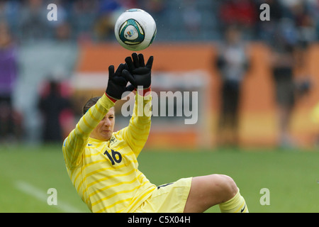 France goalkeeper Berangere Sapowicz tries to save a shot from Alex Morgan of the USA during a 2011 Women's World Cup match. Stock Photo