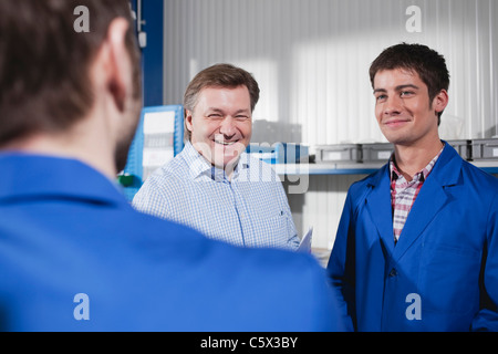 Germany, Neukirch, Apprentice and instructor Stock Photo