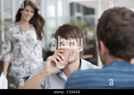 Germany, Cologne, People sitting in cafe Stock Photo