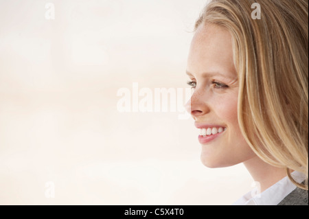 Young businesswoman laughing, side view, portrait Stock Photo