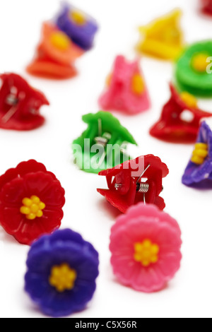 Small colored plastic hair clips isolated on white background Stock Photo