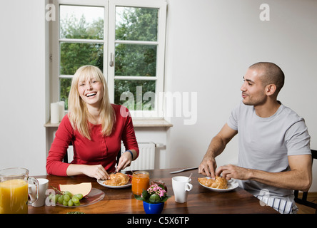 Germany, Berlin, Young couple having breakfast Stock Photo