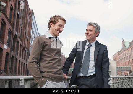 Germany, Hamburg, Two businessmen talking Stock Photo