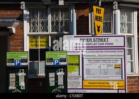 Confusing array of signs and notices at a car park in Windsor Stock Photo