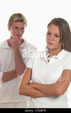 Young couple standing in studio,focus on woman in foreground Stock Photo