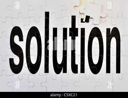 Almost finished puzzle to depict the concept 'almost found the solution'. Stock Photo