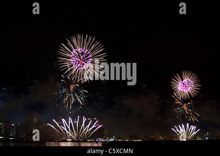 The 35th annual Macy's Fourth of July Fireworks on the Hudson River with the midtown Manhattan skyline in the background