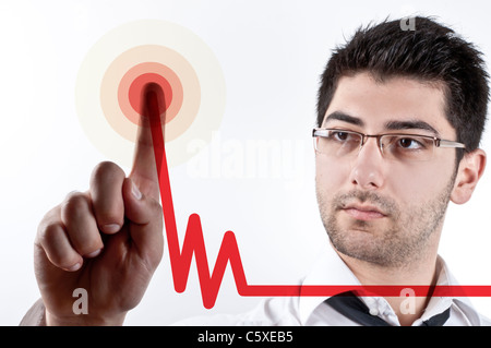 Isolated image of a young business man drawing increasing graphics with red line Stock Photo