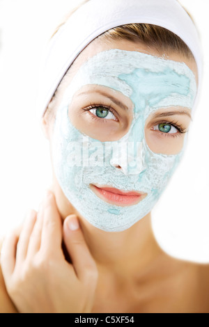 young woman wearing a purifying skin mask Stock Photo