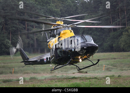 Cholmondeley Castle Pageant of Power. Bell 412 helicopters landing during a military assault demonstration. Stock Photo