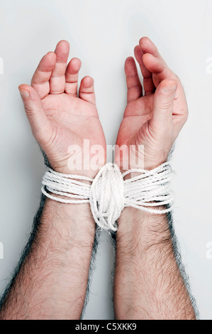 Hand tied with white rope