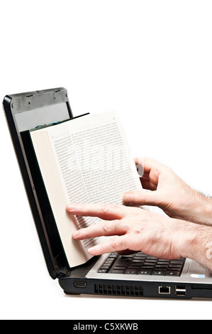 Isolated book on an laptop Stock Photo