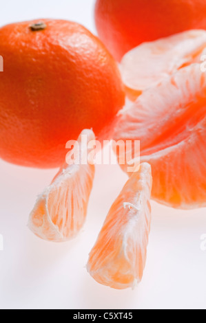 Orange segments on a white background Stock Photo