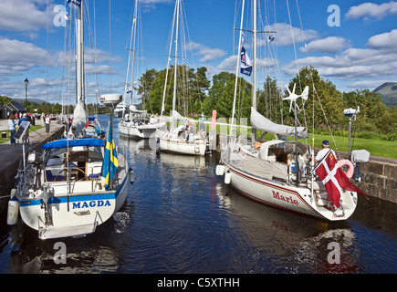 Yachts moving north through the locks on the Caledonian Canal at Banavie near Fort William in Scotland Stock Photo