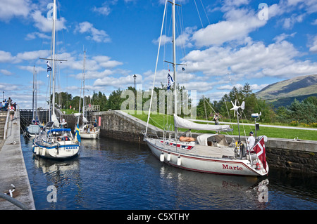 Yachts moving north through the locks on the Caledonian Canal at Banavie near Fort William in Scotland Stock Photo