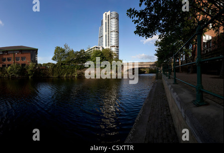 Modern buildings by The River Aire in Leeds, part of the waterfront redevelopment. Stock Photo