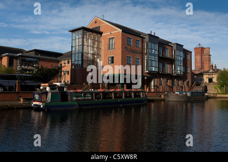 Modern buildings by The River Aire in Leeds, part of the waterfront redevelopment. Stock Photo