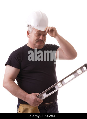 Contractor on the job trying to solve problem Stock Photo