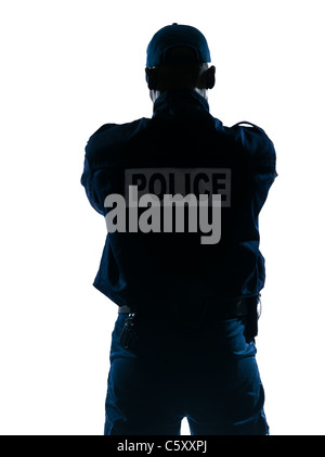 Rear view of an afro American police officer standing isolated on white isolated background Stock Photo