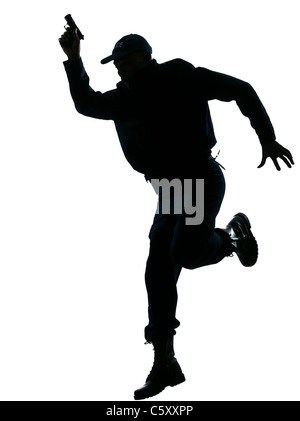 Full length of an afro American policeman running with a handgun on white isolated background Stock Photo