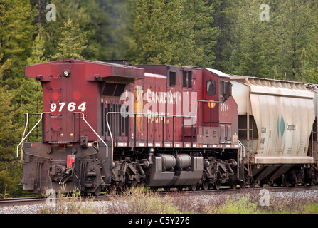 A landscape view of the rear 'pusher' on a Canadian Pacific train. A locomotive - AC4400CW just outside of Field. Stock Photo