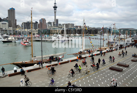 Cyclists in Wynyard Quarter waterside pedestrian area, Viaduct Harbour, Auckland New Zealand Stock Photo