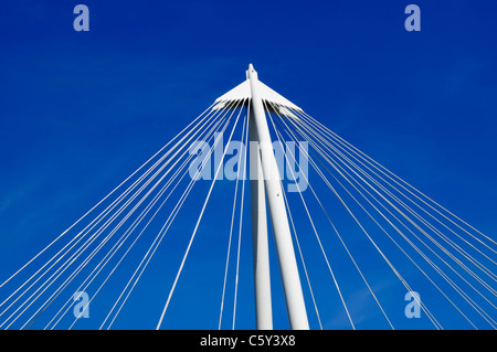 Geometric abstract architecture cluster of suspension bridge wire cables deep blue sky background pointing upwards in a triangle shape England UK Stock Photo