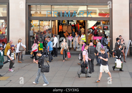 London busy street scene aerial view looking down at shoppers in & around Primark clothing retail shopping store entrance in Oxford Street West End UK Stock Photo