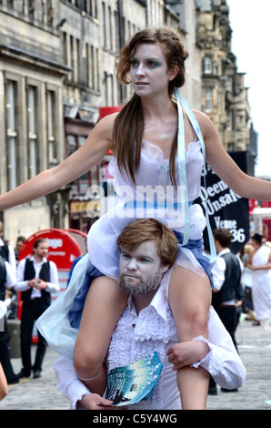 Cast members promote their Edinburgh Fringe play on the High Street. Stock Photo