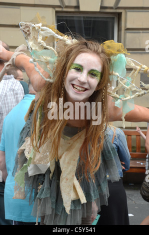 A performer from the theatre group Jam Jar Productions promotes her play, 'Thirty Two Teeth', on the High Street in Edinburgh. Stock Photo