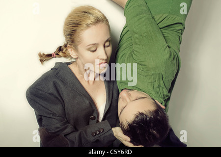 A couple young lovers lying on the floor Stock Photo